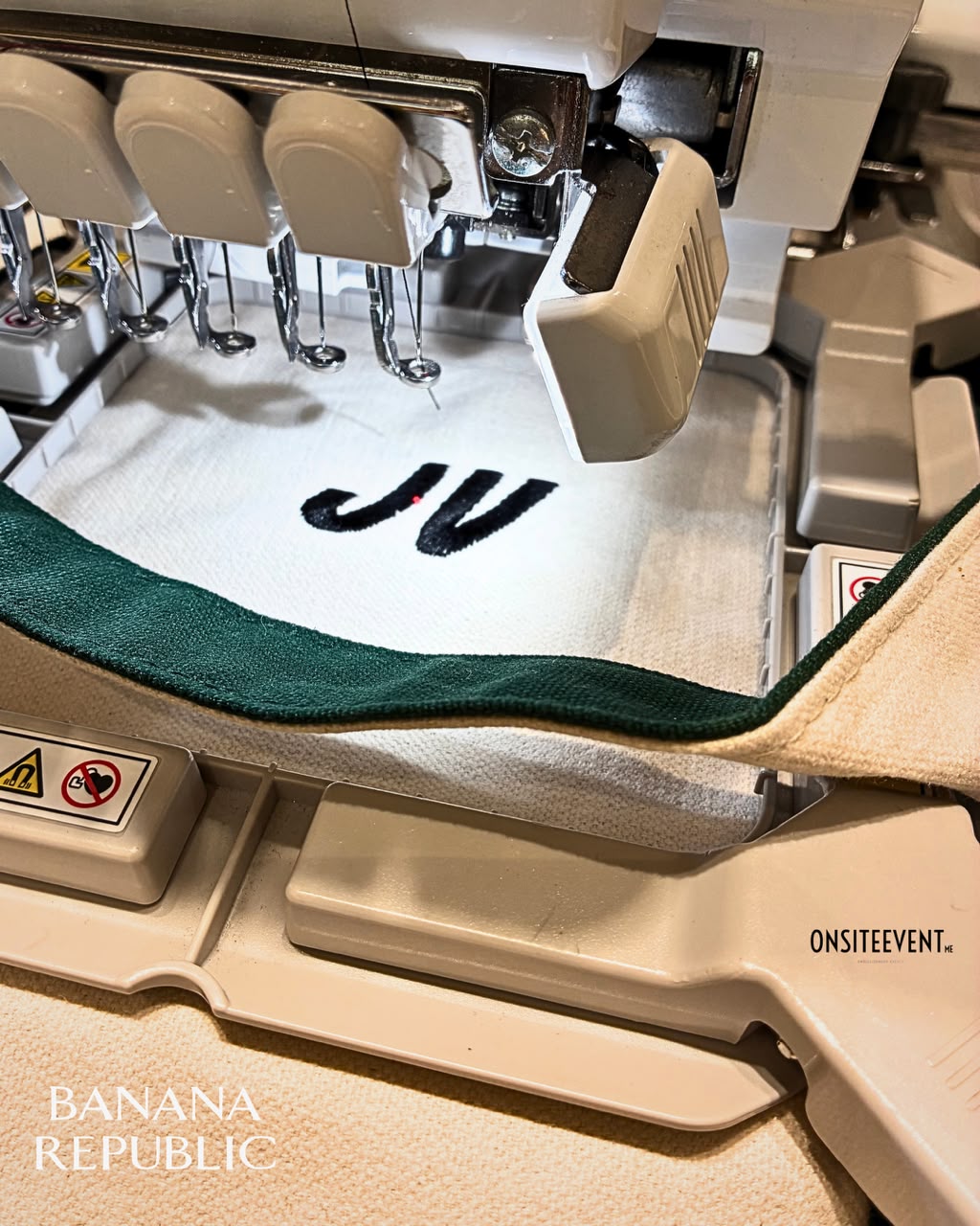 Live embroidery machine monogramming a tote bag at a Banana Republic event
